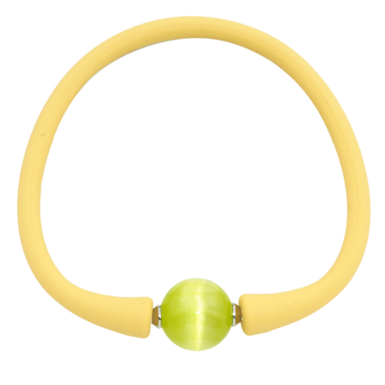 Браслет Xuping Родий Желтый каучуковый шнур с салатовой бусиной размер 17.5см х 4мм; ø 12мм фото №1